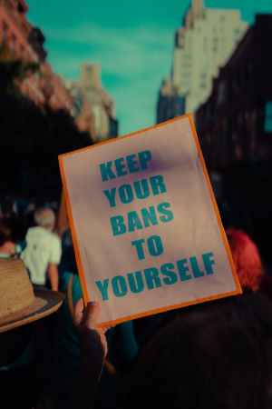 close up shot of a person holding a poster